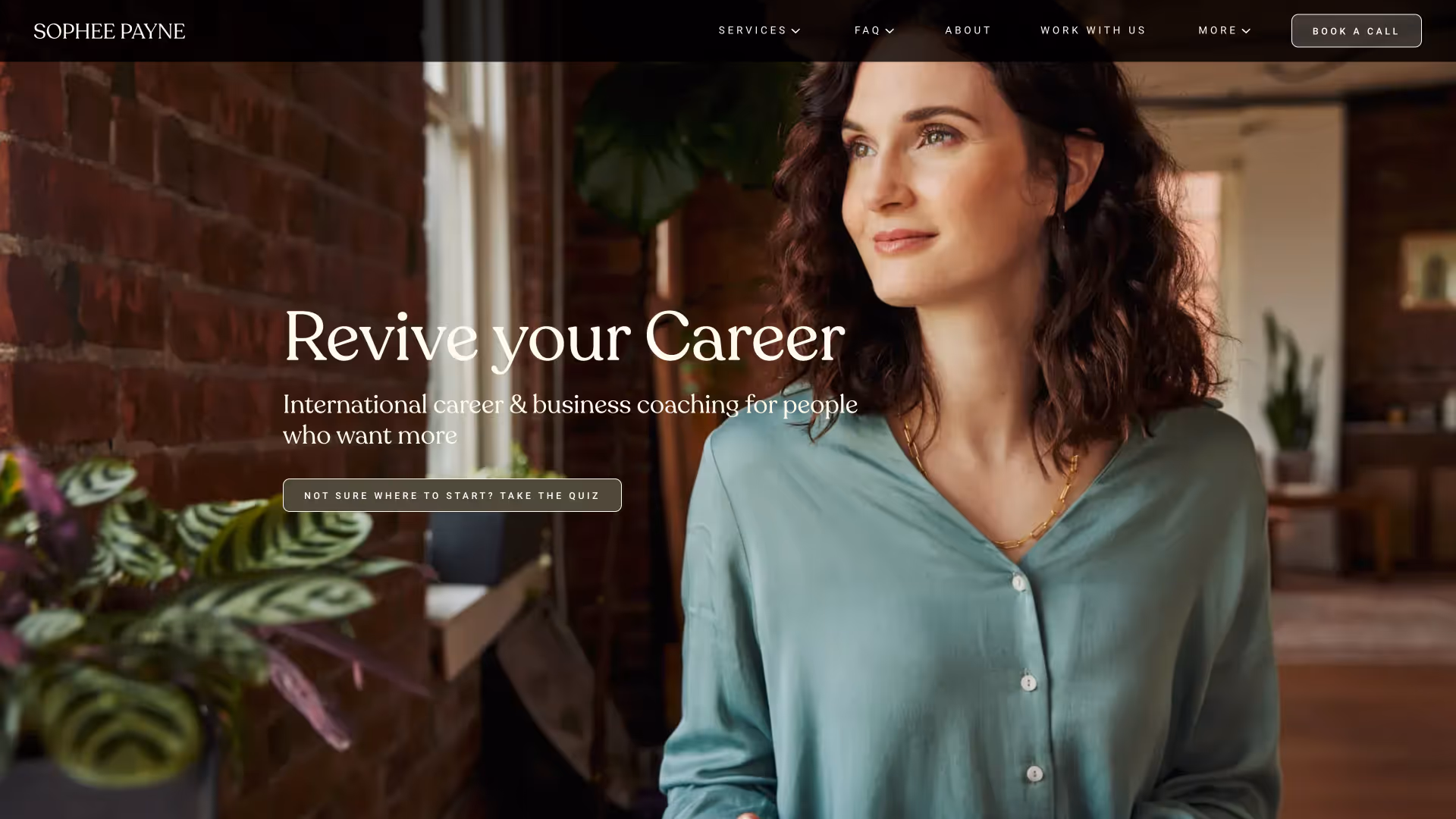 A woman with curly dark hair wearing a teal blouse looks thoughtfully to the side in a warm, modern workspace with brick walls and plants. Overlaid text reads: 'Revive your Career. International career & business coaching for people who want more.' There is a navigation bar at the top with options like Services, FAQ, About, Work With Us, and a 'Book a Call' button.